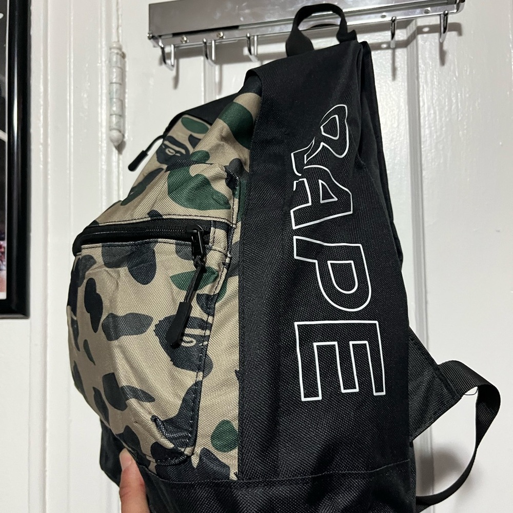 A bathing ape camo bookbag(bag is new but with the years color light faded away)